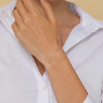 Minimalist 14K gold bracelet with repeating infinity symbols