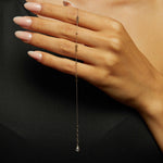 14K gold bracelet with multiple small infinity charms and decorative beads