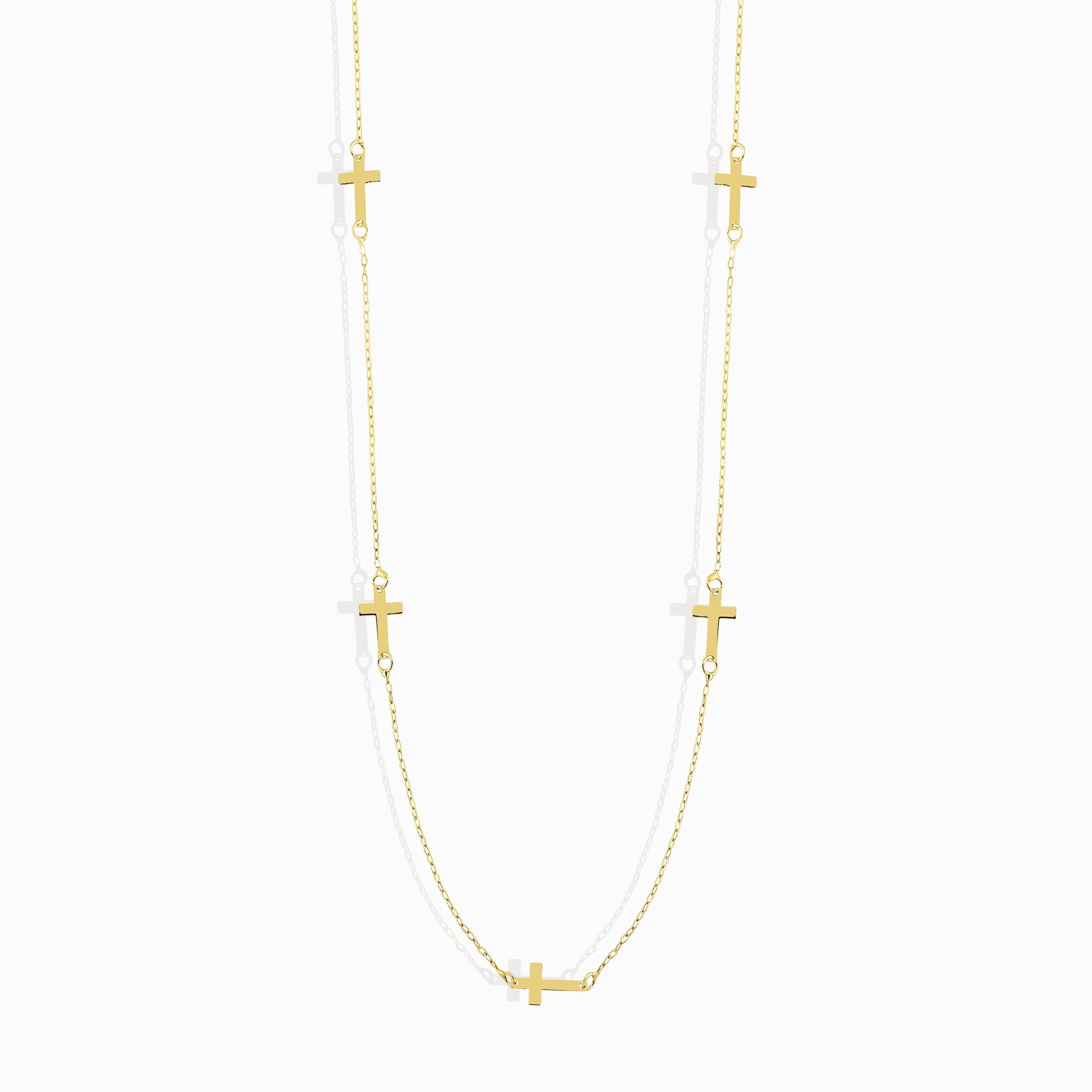 14K gold necklace with multiple small cross charms elegant and minimalistic.
