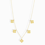 14K gold necklace featuring multiple four-leaf clover charms,