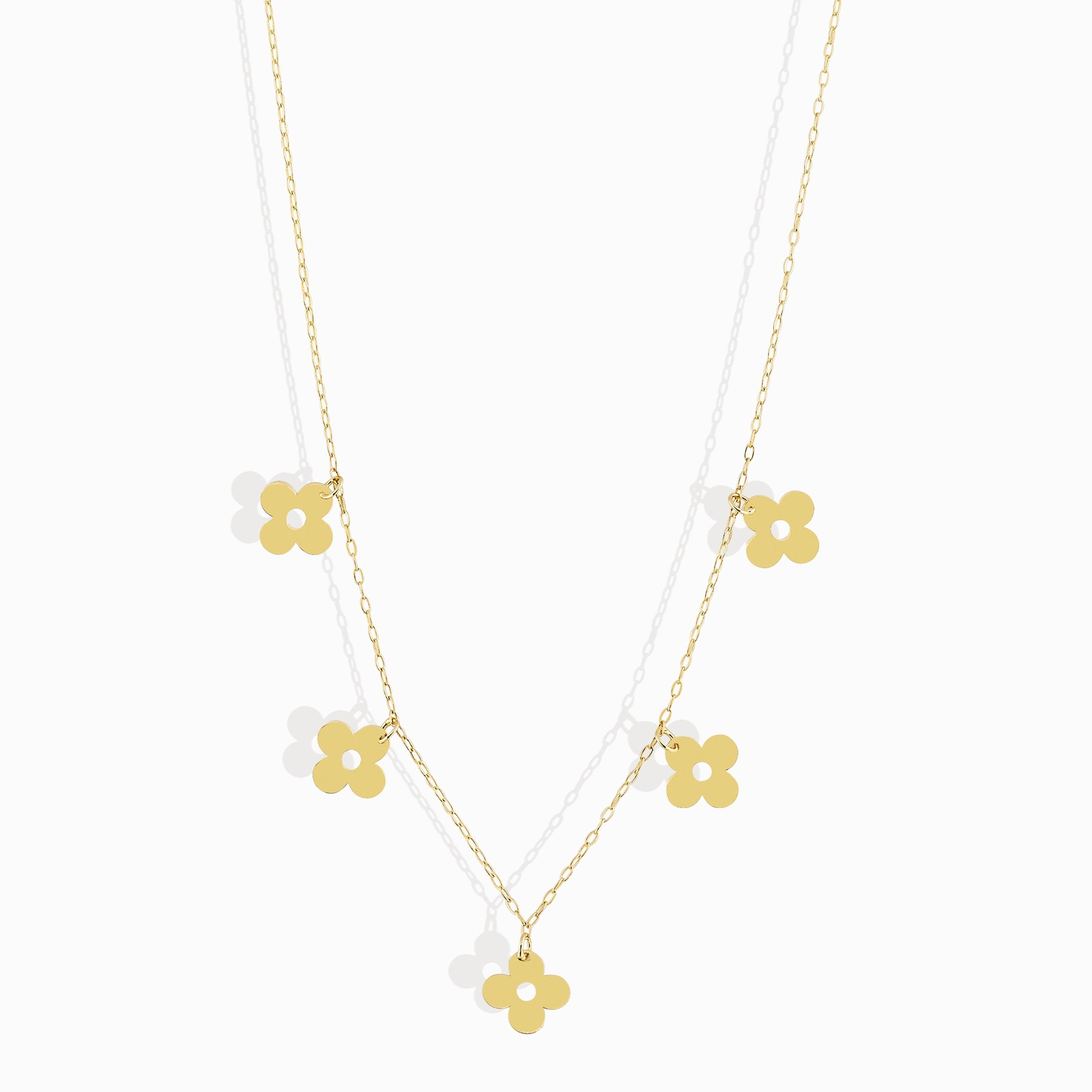 14K gold necklace featuring multiple four-leaf clover charms,