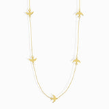 Minimalist 14K gold bracelet with flying bird charms