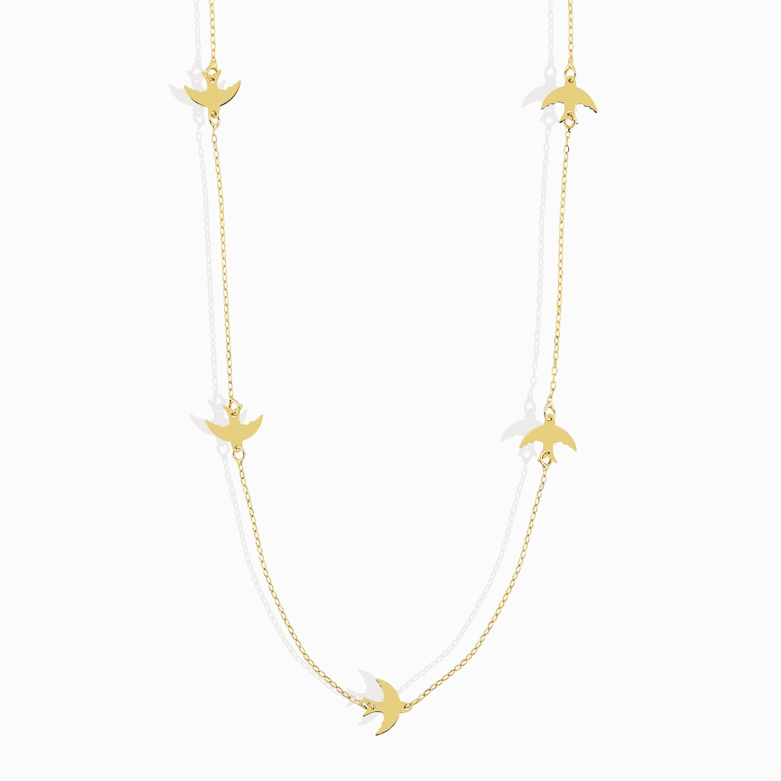 Minimalist 14K gold bracelet with flying bird charms