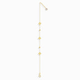 Minimalist 14K gold bracelet with clover-shaped charms and tiny textured accents, styled on emerald green silk fabric