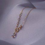 14K gold necklace with five small open flower charms displayed – elegant and minimalist.