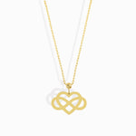 14K gold infinity heart necklace resting