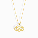 14K gold infinity heart necklace resting