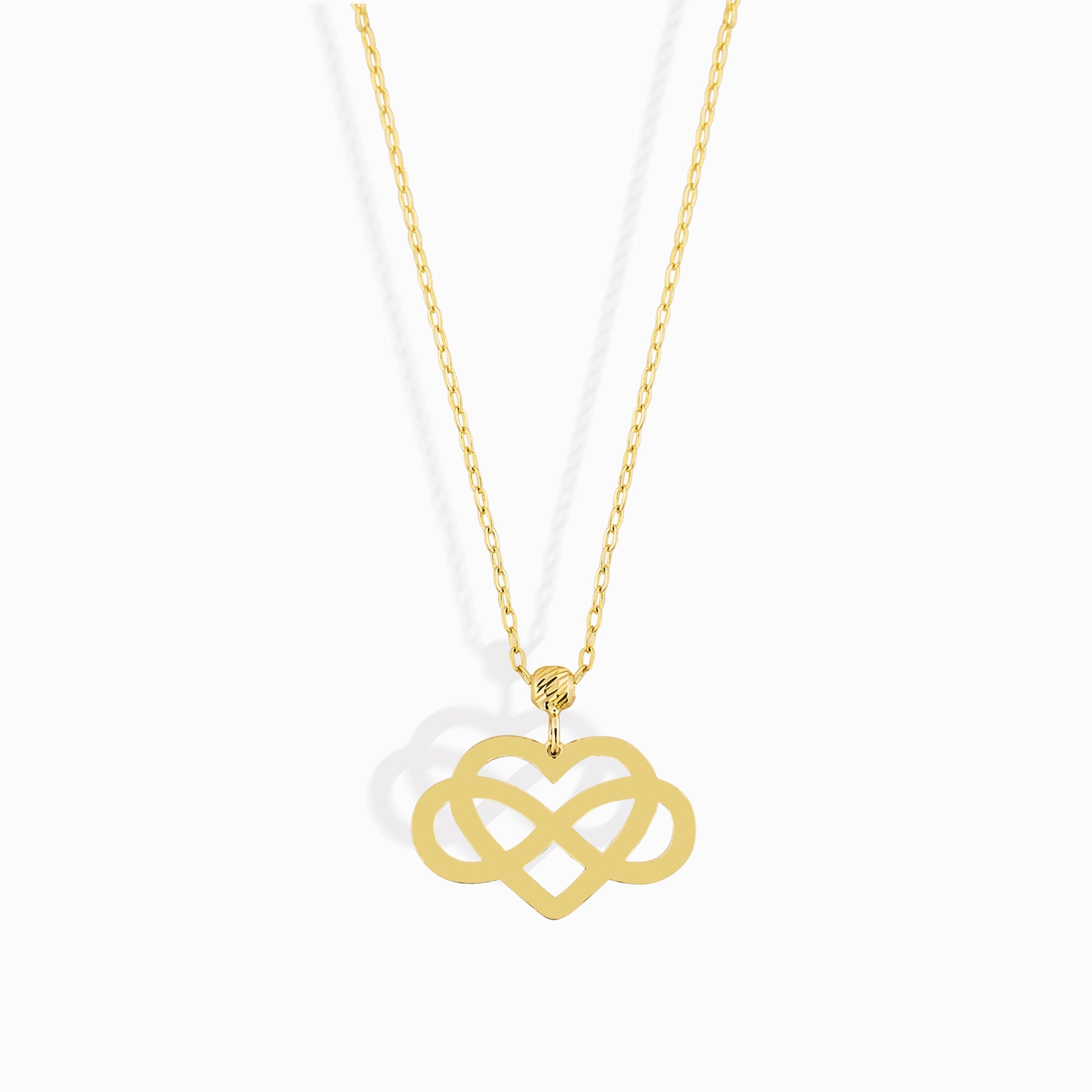 14K gold infinity heart necklace resting