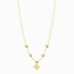Minimal 14K gold clover charm necklace with polished gold beads,
