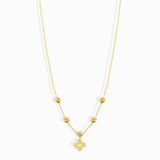 Minimal 14K gold clover charm necklace with polished gold beads,