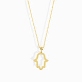 14K gold Hamsa hand necklace on emerald
