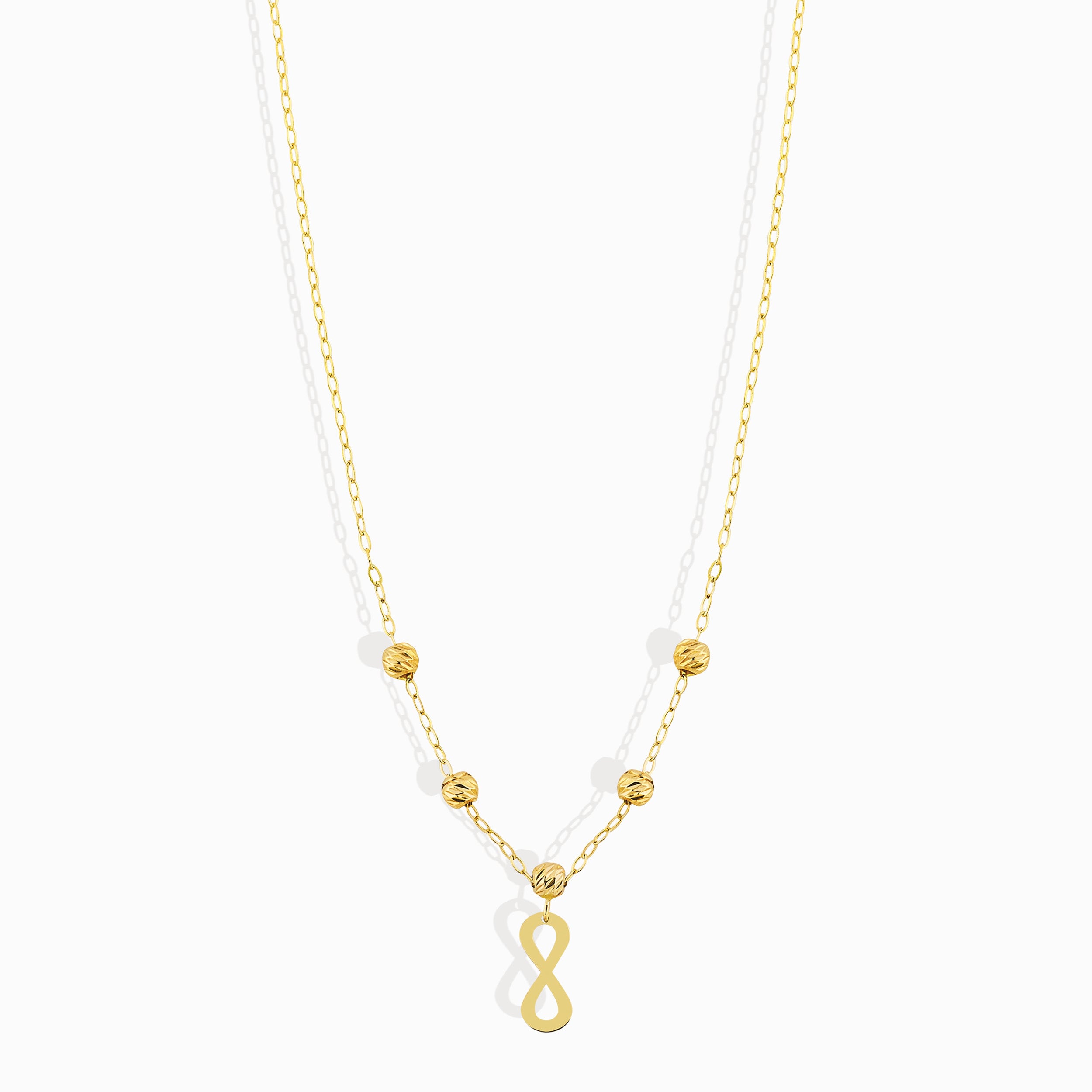 Minimalist 14K gold necklace with an infinity pendant and textured beaded chain,