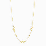 Minimalist 14K gold necklace with three infinity symbol charms