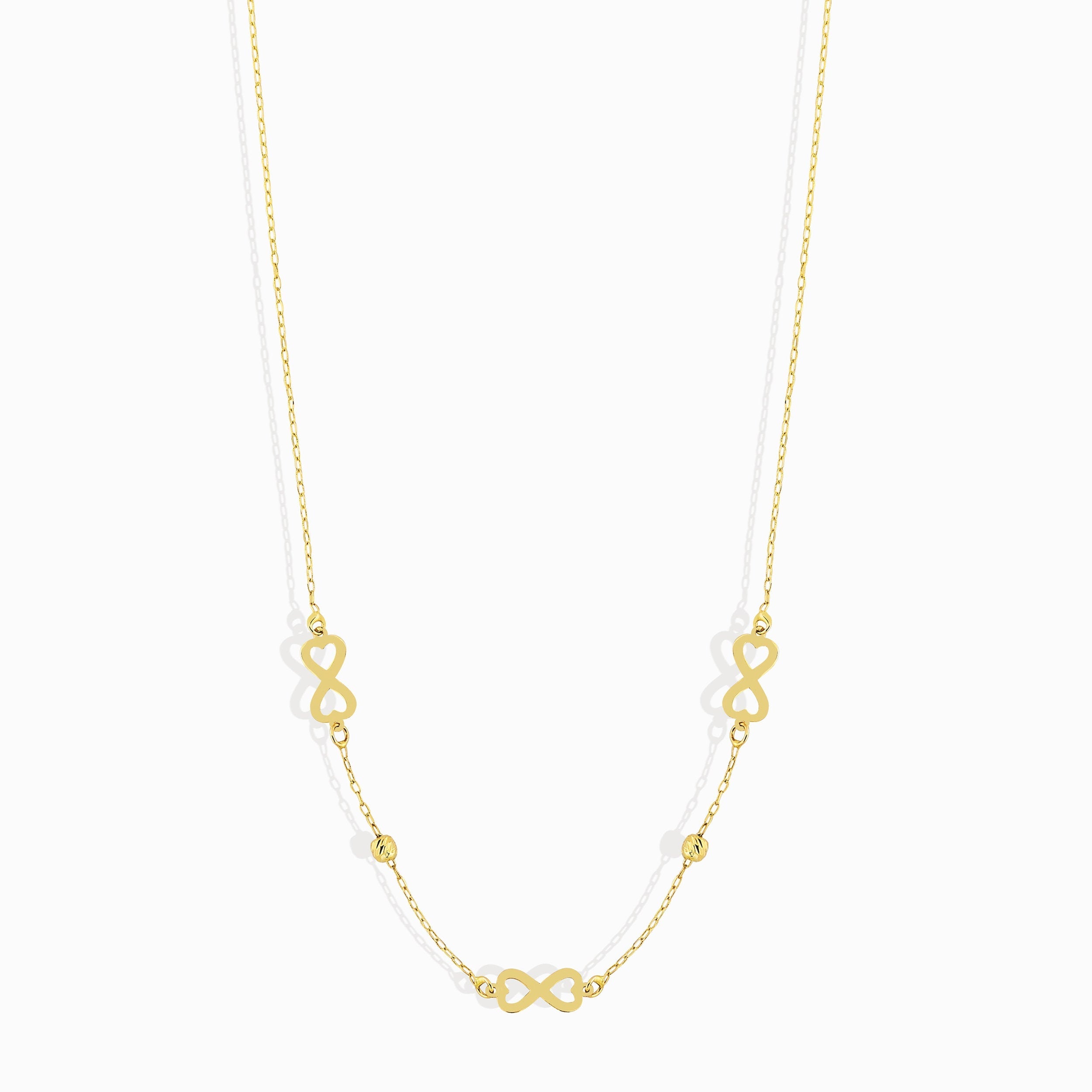 Minimalist 14K gold necklace with three infinity symbol charms
