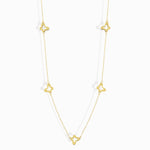 Minimalist 14K gold necklace with three evenly spaced clover charms,