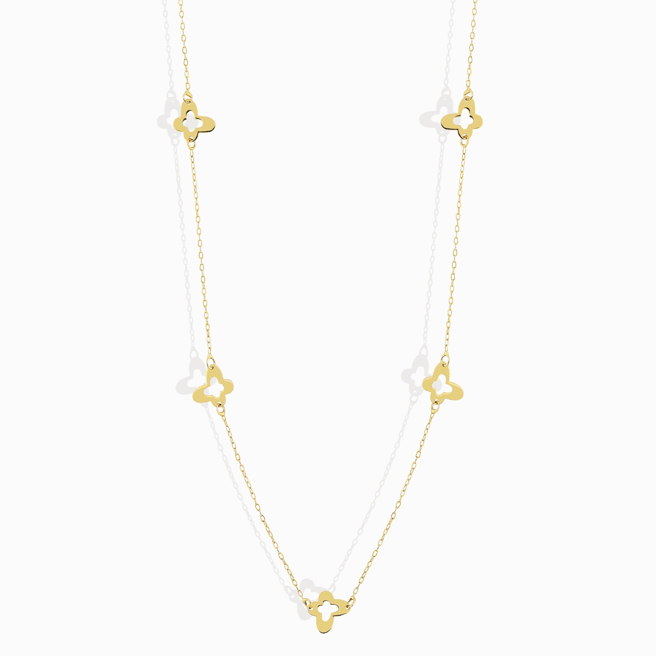Minimalist 14K gold necklace with three evenly spaced clover charms,
