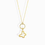 Minimal 14K gold necklace featuring a four-leaf clover charm hanging from a twisted circle,
