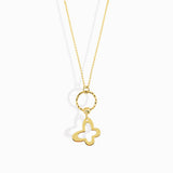 Minimal 14K gold necklace featuring a four-leaf clover charm hanging from a twisted circle,