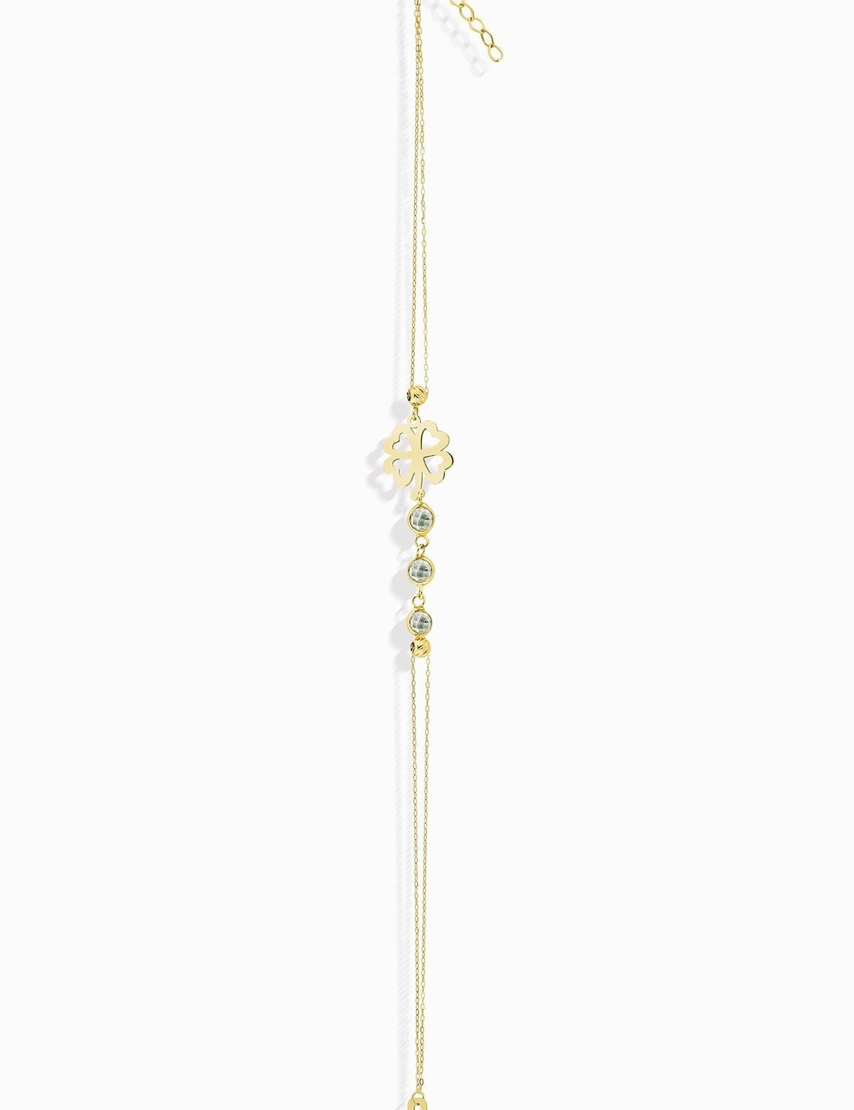 14K gold bracelet with four-leaf clover charm and gemstone details
