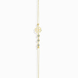 14K gold bracelet with four-leaf clover charm and gemstone details