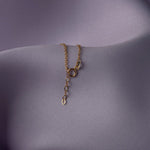 14K gold bracelet with multiple small infinity charms and decorative