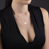 14K gold elephant pendant necklace placed