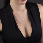 Minimalist 14K gold necklace with a geometric horse pendant,