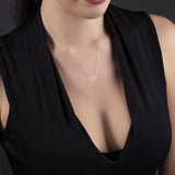 Minimalist 14K gold necklace with a geometric horse pendant,