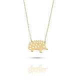 Close-up of a 14K gold hedgehog pendant necklace
