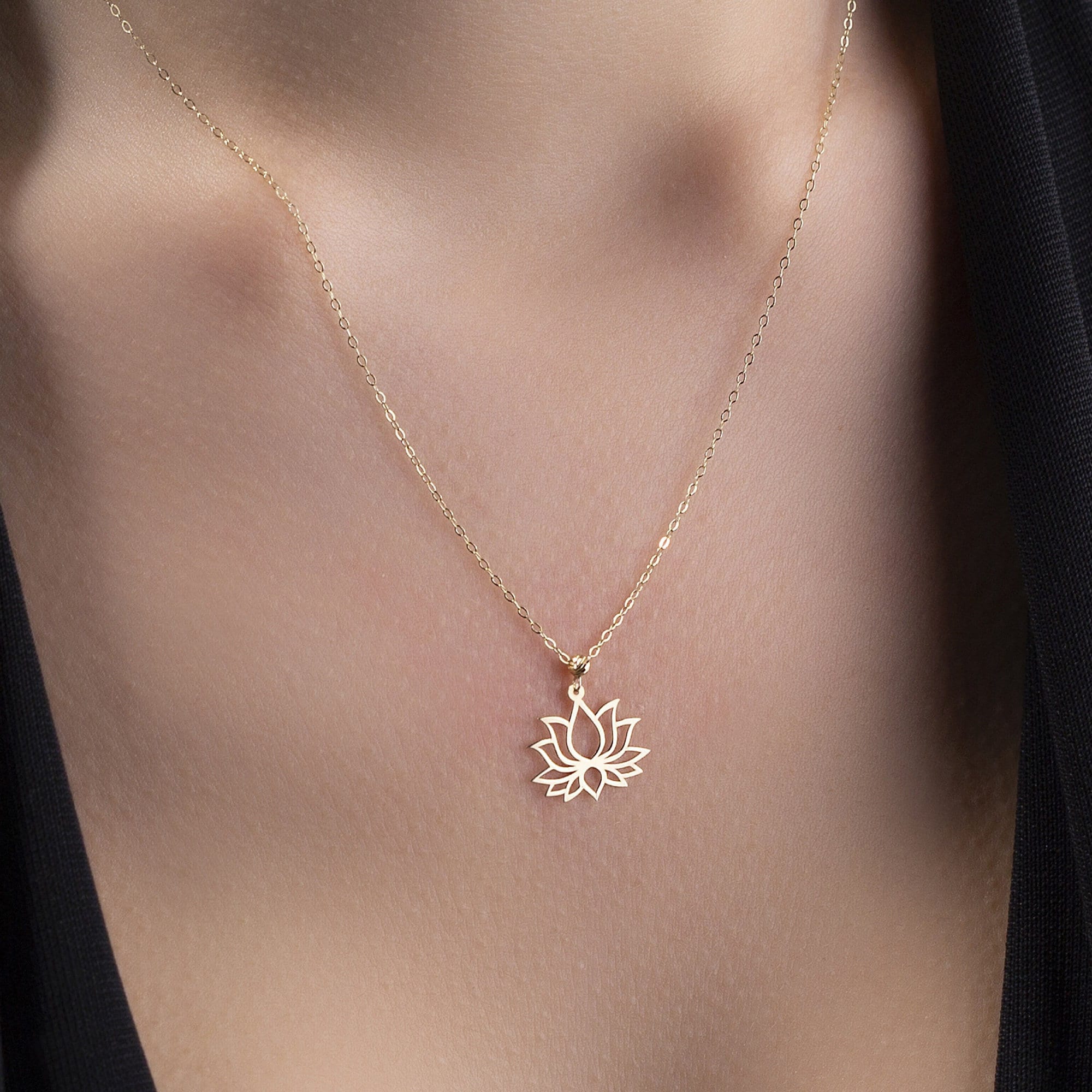 14K gold lotus flower pendant necklace  symbolizing purity and spiritual balance.
