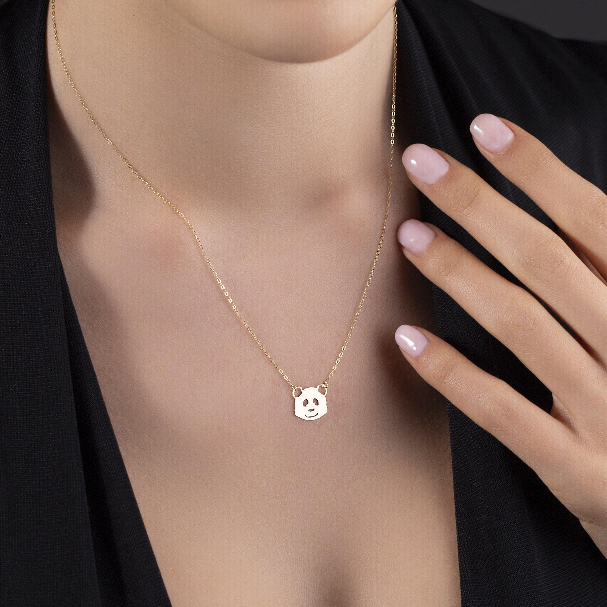 14K gold necklace featuring a smiling panda face pendant playful and minimalist jewelry style.