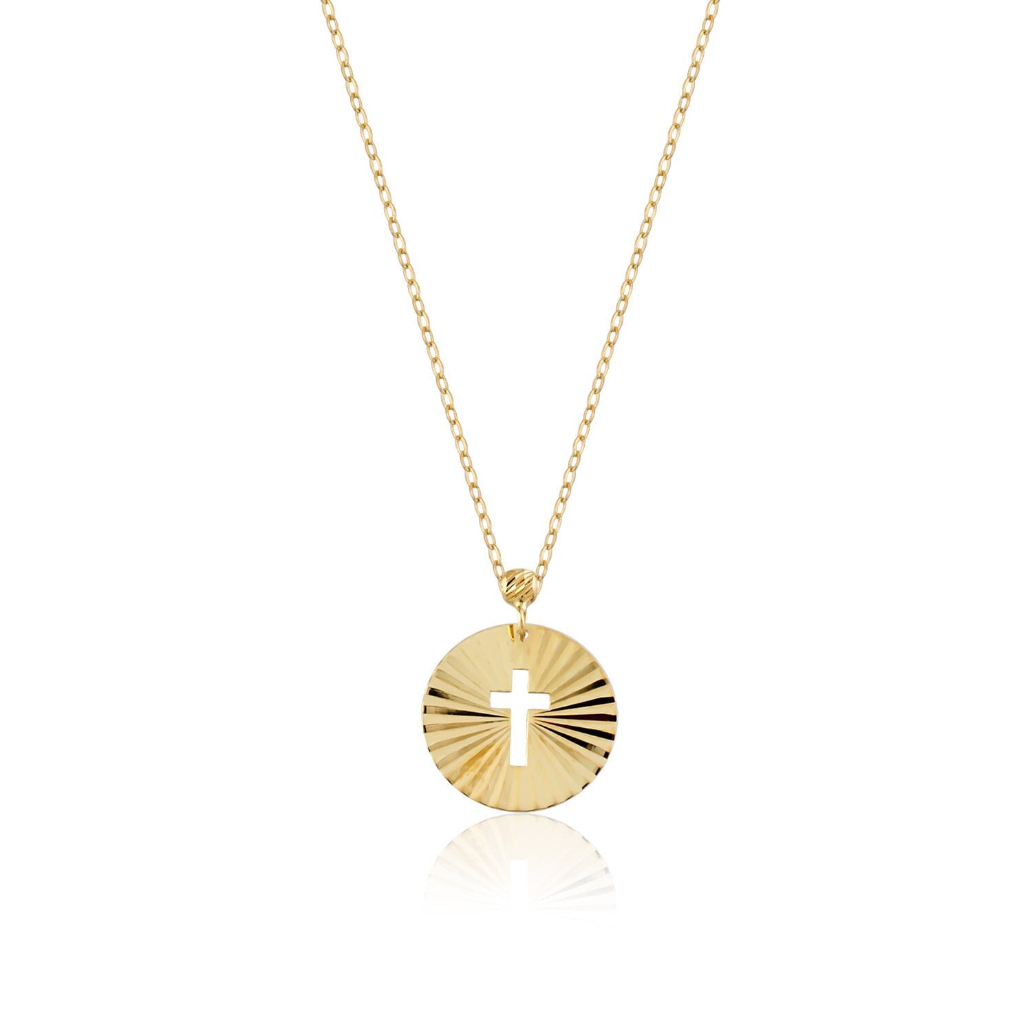 Minimalist 14K gold medallion necklace with a central cutout cross and radiant sunbeam engravings