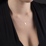 Real 14K gold necklace featuring a Tinkerbell-style fairy silhouette pendant,