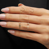 14K gold threader earrings with cross charm and clear crystal bead on model