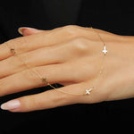 14K gold necklace with multiple small cross charms elegant and minimalistic.