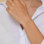 14K gold bracelet with central leaf charm,