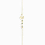 14K gold bracelet with four-leaf clover charm and gemstone details