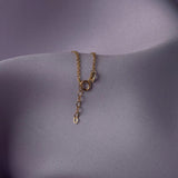 14K gold bracelet with four-leaf clover charm and gemstone details