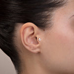 model wearing baguette cluster 14k gold tragus helix cartilage stud